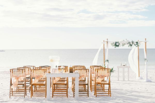 Beautiful wedding setup with chairs and arch on St. Pete Beach, Florida.